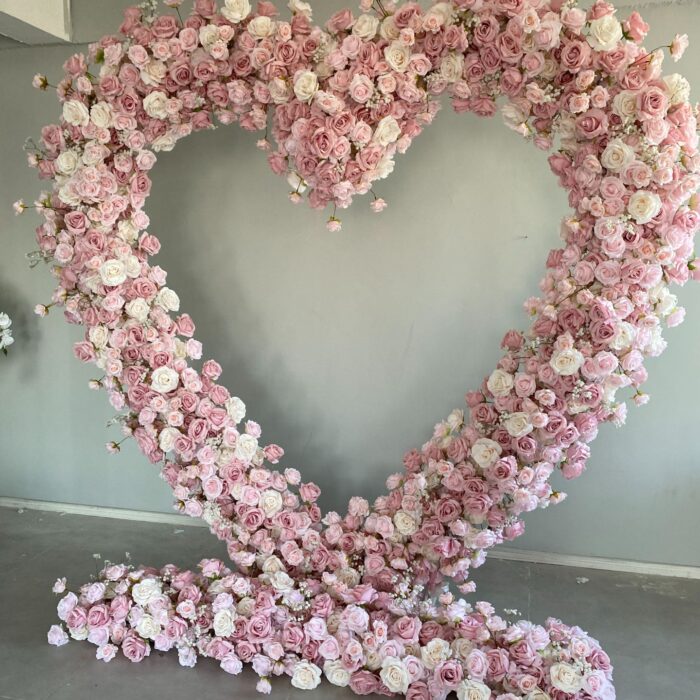 Delicate Heart-Shaped Arch with Soft Pink and Beige Roses for a Serene Wedding Atmosphere