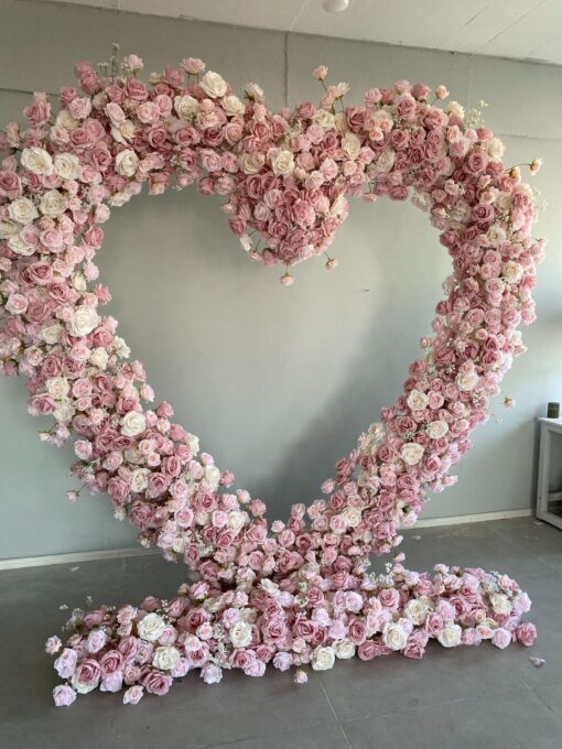 Delicate Heart-Shaped Arch with Soft Pink and Beige Roses for a Serene Wedding Atmosphere