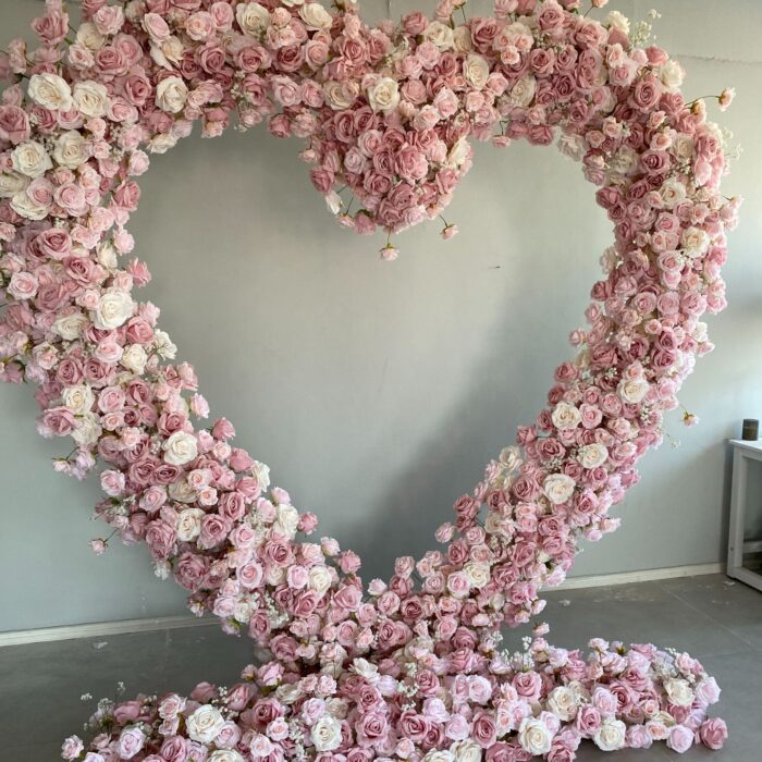 Delicate Heart-Shaped Arch with Soft Pink and Beige Roses for a Serene Wedding Atmosphere