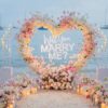 Delicate Pink and White Rose Heart Arch for Proposal with Lovely Floral Design