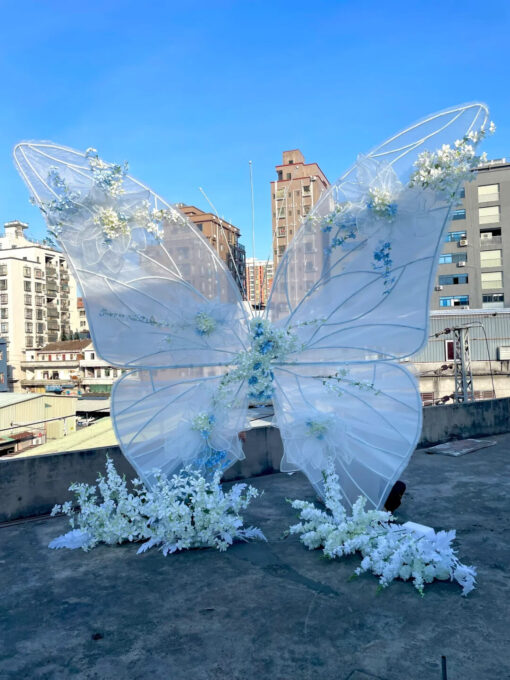 Dreamy Butterfly Backdrop with White Transparent Wings and Blue Floral Accents