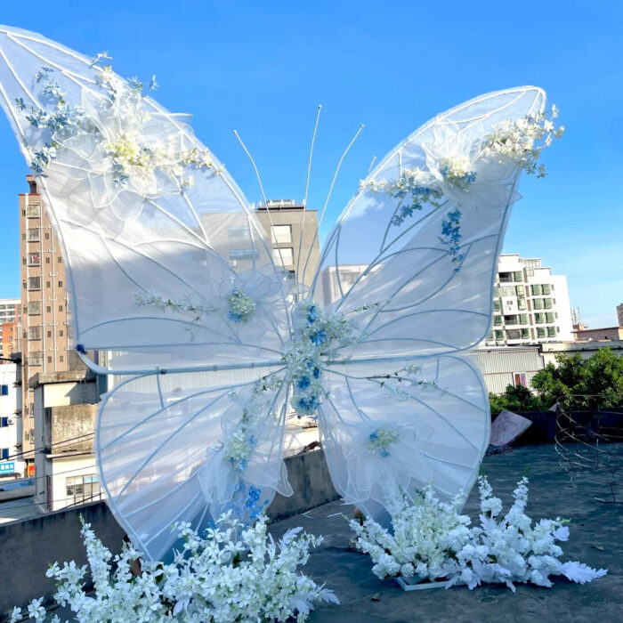 Dreamy Butterfly Backdrop with White Transparent Wings and Blue Floral Accents