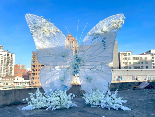 Dreamy Butterfly Backdrop with White Transparent Wings and Blue Floral Accents