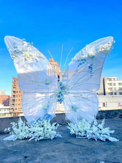 Dreamy Butterfly Backdrop with White Transparent Wings and Blue Floral Accents