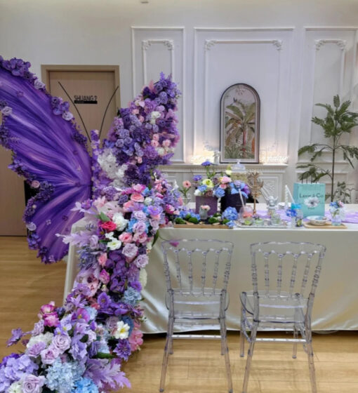 Elegant Butterfly Backdrop Featuring Purple Wings and Victorian Floral Arrangements