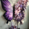 Elegant Butterfly Backdrop with Soft Lavender and Mauve Floral Arrangement