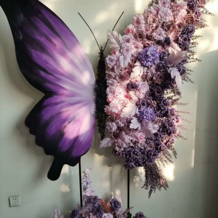 Elegant Butterfly Backdrop with Soft Lavender and Mauve Floral Arrangement