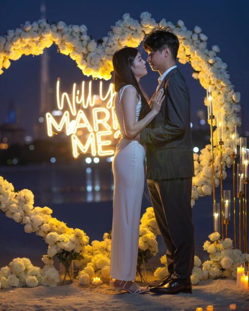 Elegant Proposal Planner in Dubai: Heart-Shaped White Rose Arch for Wedding Bliss