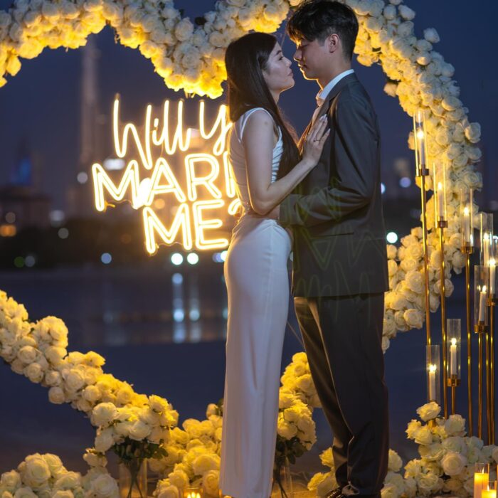 Elegant Proposal Planner in Dubai: Heart-Shaped White Rose Arch for Wedding Bliss