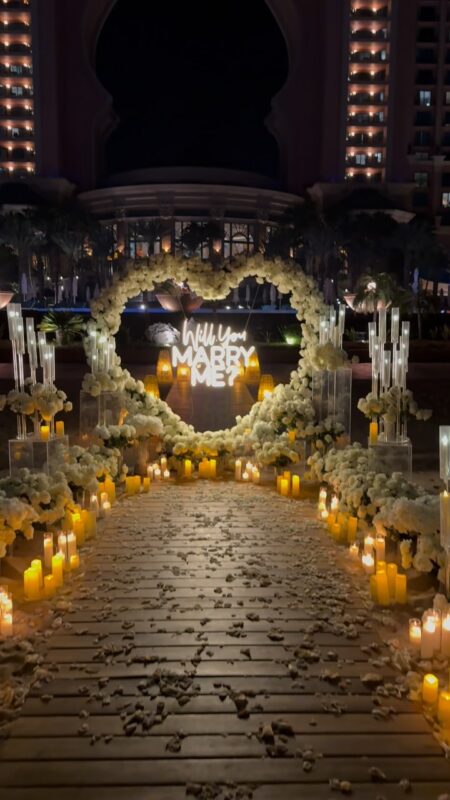 Elegant Proposal Planner in Dubai: Heart-Shaped White Rose Arch for Wedding Bliss