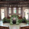 Elegant White and Green Wedding Arch with Floral Accents for a Timeless Celebration