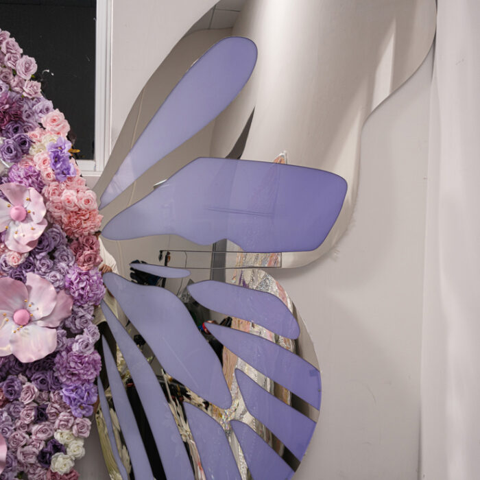 Eye-Catching Butterfly Backdrop with Mirror Details and Artificial Floral Arrangement