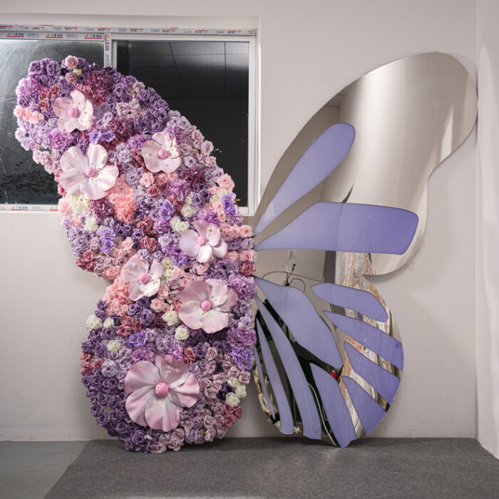 Eye-Catching Butterfly Backdrop with Mirror Details and Artificial Floral Arrangement