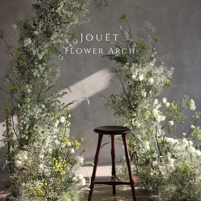 Fresh and Elegant Wedding Arch Decor Featuring Baby's Breath and Greenery