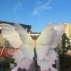 Handcrafted White and Pink Butterfly Backdrop for Elegant Outdoor Weddings