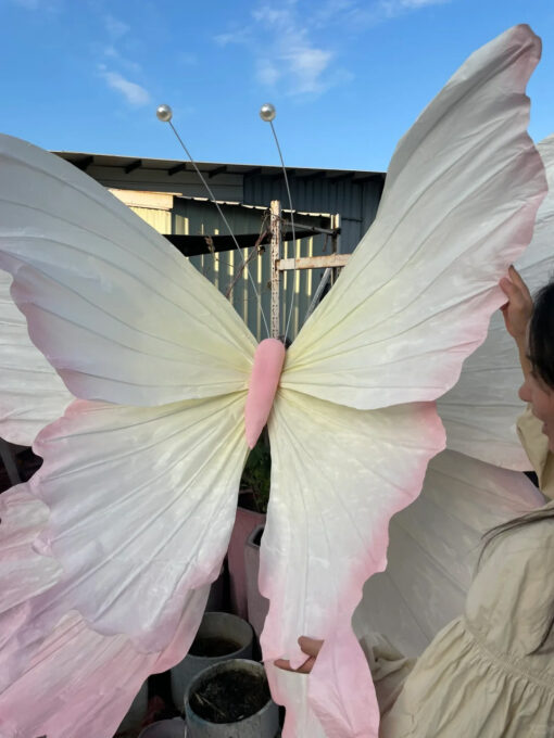Handcrafted White and Pink Butterfly Backdrop for Elegant Outdoor Weddings