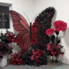 Intricate Gothic Butterfly Backdrop with Red and Black Gradient for Weddings