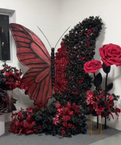 Intricate Gothic Butterfly Backdrop with Red and Black Gradient for Weddings