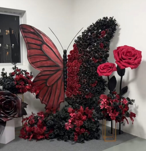 Intricate Gothic Butterfly Backdrop with Red and Black Gradient for Weddings