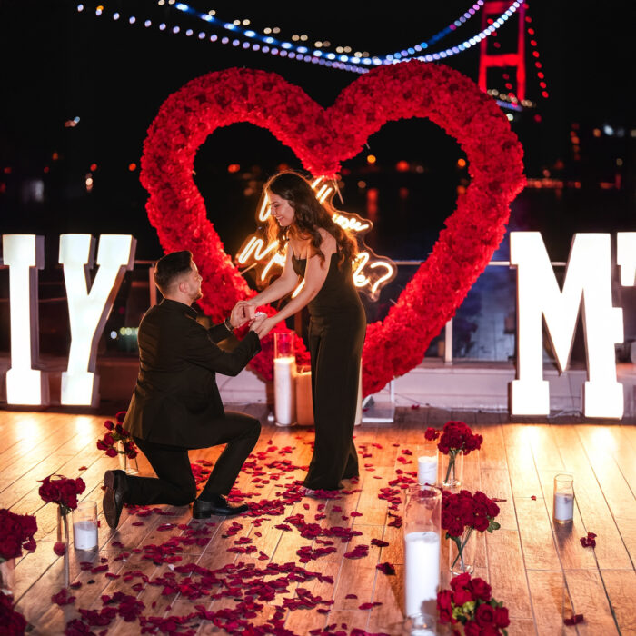 Love-Filled Heart Arch with Red Roses for an Unforgettable Proposal Backdrop