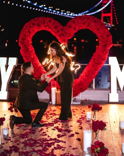 Love-Filled Heart Arch with Red Roses for an Unforgettable Proposal Backdrop