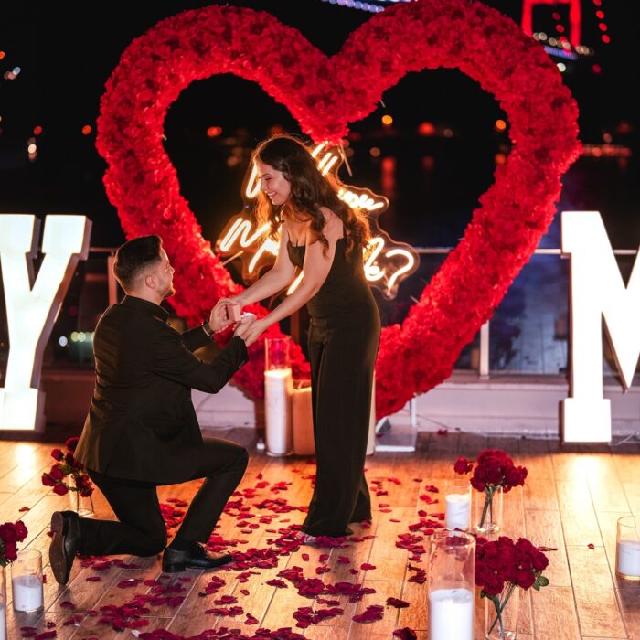 Love-Filled Heart Arch with Red Roses for an Unforgettable Proposal Backdrop
