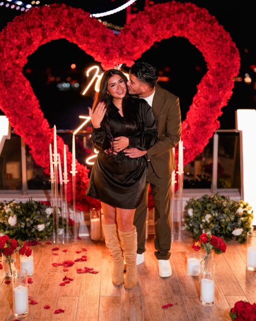 Love-Filled Heart Arch with Red Roses for an Unforgettable Proposal Backdrop