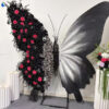 Luxurious Butterfly Backdrop with Black and White Wings and Artificial Red Rose Design