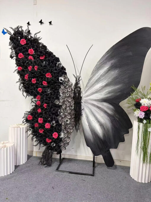 Luxurious Butterfly Backdrop with Black and White Wings and Artificial Red Rose Design