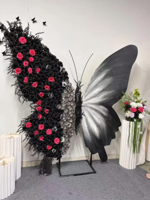 Luxurious Butterfly Backdrop with Black and White Wings and Artificial Red Rose Design