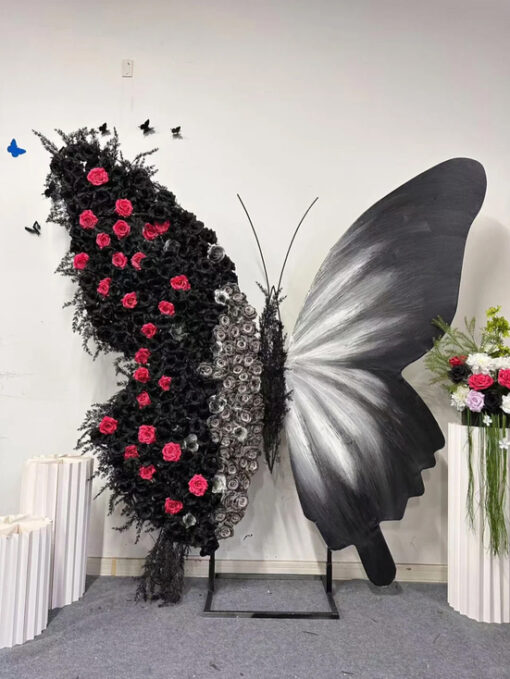 Luxurious Butterfly Backdrop with Black and White Wings and Artificial Red Rose Design