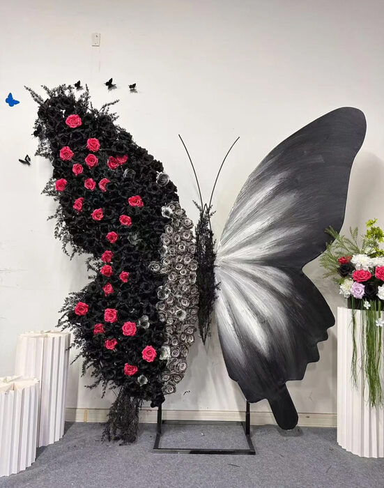 Luxurious Butterfly Backdrop with Black and White Wings and Artificial Red Rose Design