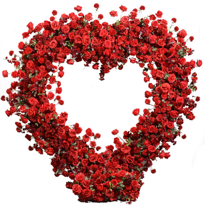 Luxurious Heart-Shaped Arch with Bold Red Roses and Greenery for a Majestic Wedding Backdrop