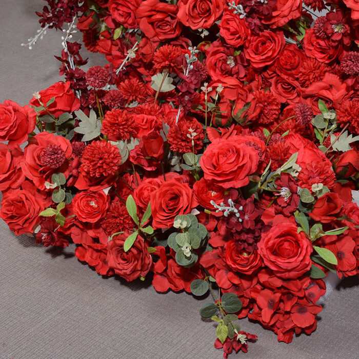 Luxurious Heart-Shaped Arch with Bold Red Roses and Greenery for a Majestic Wedding Backdrop