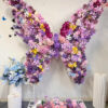 Luxury Butterfly Backdrop Featuring Multicolor Floral Arrangement for Memorable Events