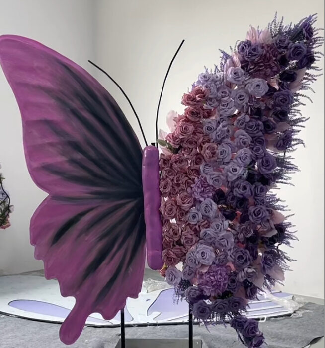 Modern Butterfly Backdrop with Bold Purple-Black Gradient and Floral Accents