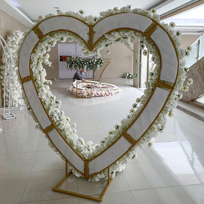 Sophisticated Heart-Shaped Arch with Pink and White Flowers for a Spring Wedding Backdrop