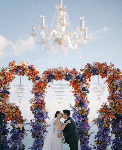 Outdoor Bohemian Wedding in Bali: Colorful Orange and Purple Arches with Floral Touch