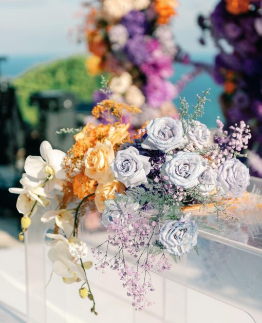 Outdoor Bohemian Wedding in Bali: Colorful Orange and Purple Arches with Floral Touch