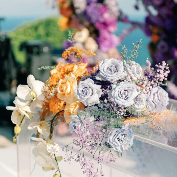 Outdoor Bohemian Wedding in Bali: Colorful Orange and Purple Arches with Floral Touch