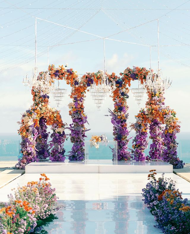 Outdoor Bohemian Wedding in Bali: Colorful Orange and Purple Arches with Floral Touch
