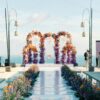 Outdoor Bohemian Wedding in Bali: Colorful Orange and Purple Arches with Floral Touch