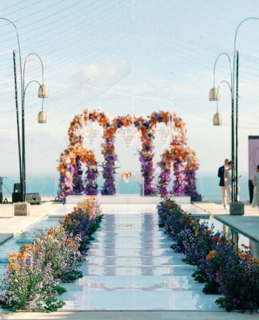 Outdoor Bohemian Wedding in Bali: Colorful Orange and Purple Arches with Floral Touch