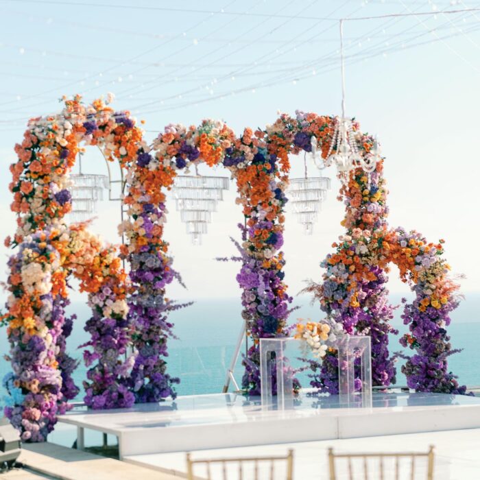 Outdoor Bohemian Wedding in Bali: Colorful Orange and Purple Arches with Floral Touch