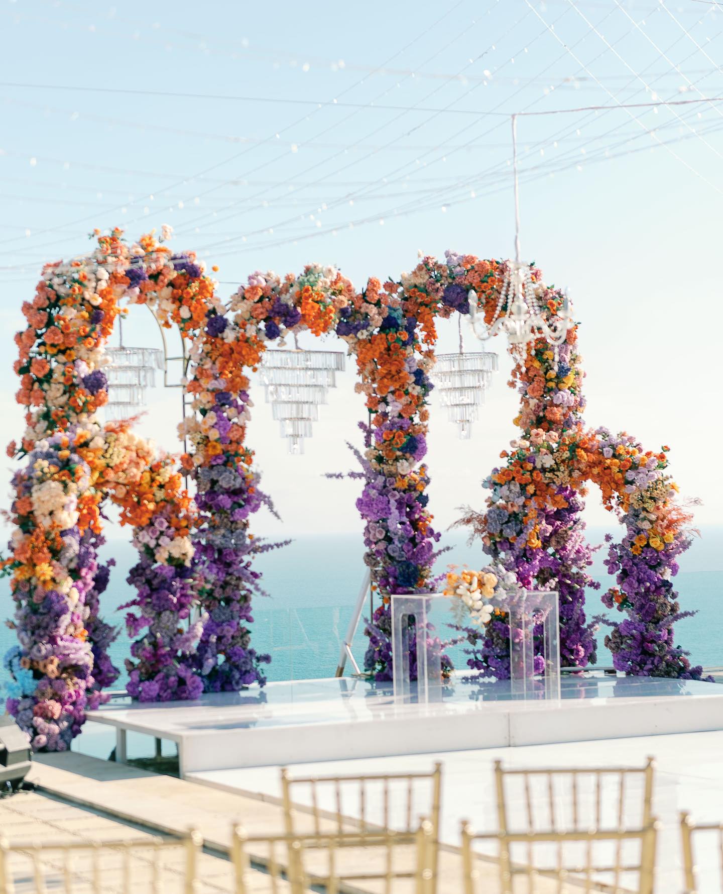 Outdoor Bohemian Wedding in Bali: Colorful Orange and Purple Arches with Floral Touch