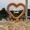 Pink Rose Heart Arch with Floral Backdrop for a Dreamy Anniversary Moment