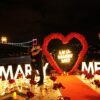 Red Rose Backdrop and Heart Arch for a Heartfelt Proposal Moment