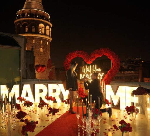 Red Rose Backdrop and Heart Arch for a Heartfelt Proposal Moment