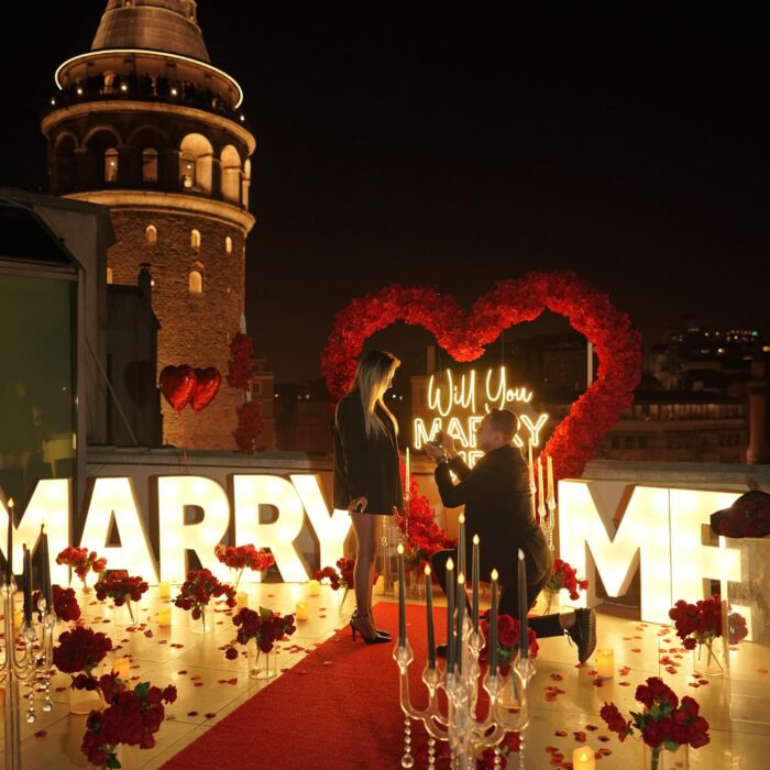 Red Rose Backdrop and Heart Arch for a Heartfelt Proposal Moment