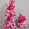 Romantic Peach and White Rose Wedding Arch with Hot Pink Accents for Elegant Events